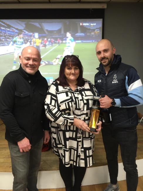 Nick Gale receives his memento for 150 games from Ieuan Evans (WRU) and Wendy Rossiter